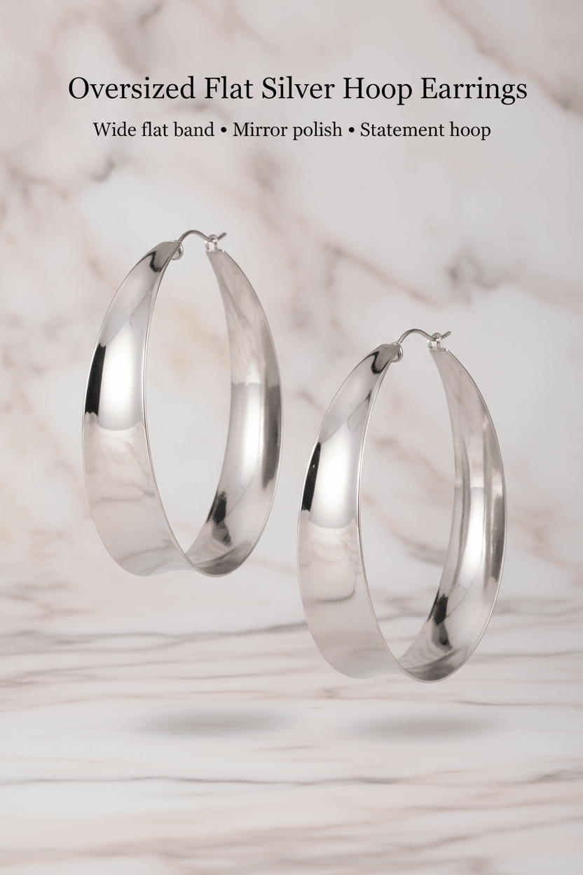 Oversized Flat Silver Hoop Earrings worn shot on marble background