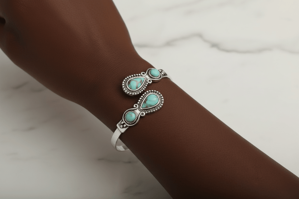 Turquoise Stone Silver Cuff Bracelet - worn on wrist with darker skin tone