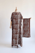 Leopard print moo moo kaftan dress with matching scarf, white studio background