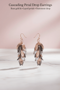 Cascading Petal Drop Earrings on pink marble background