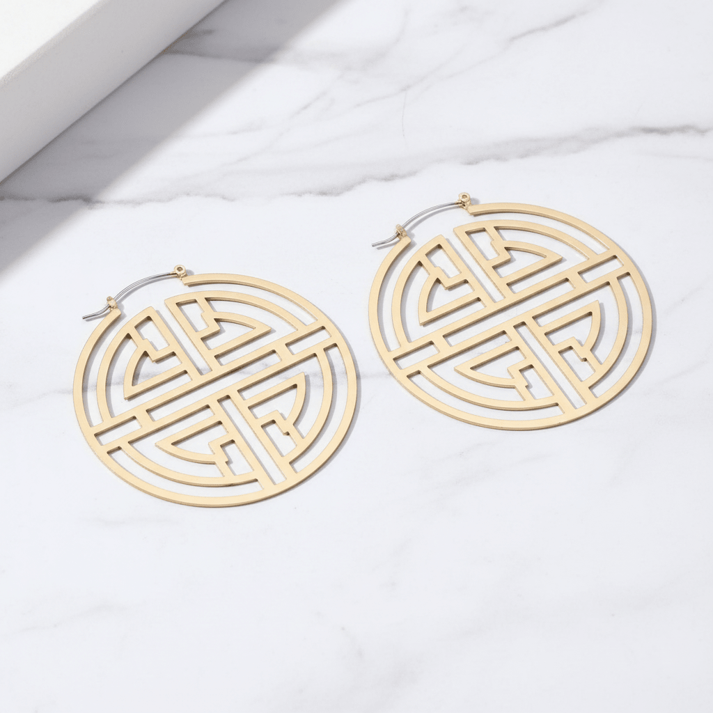 Oversized Gold Geometric Circle Hoop Earrings - flat lay on marble