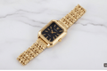 Gold Rectangle Black Dial Women's Watch - flat lay